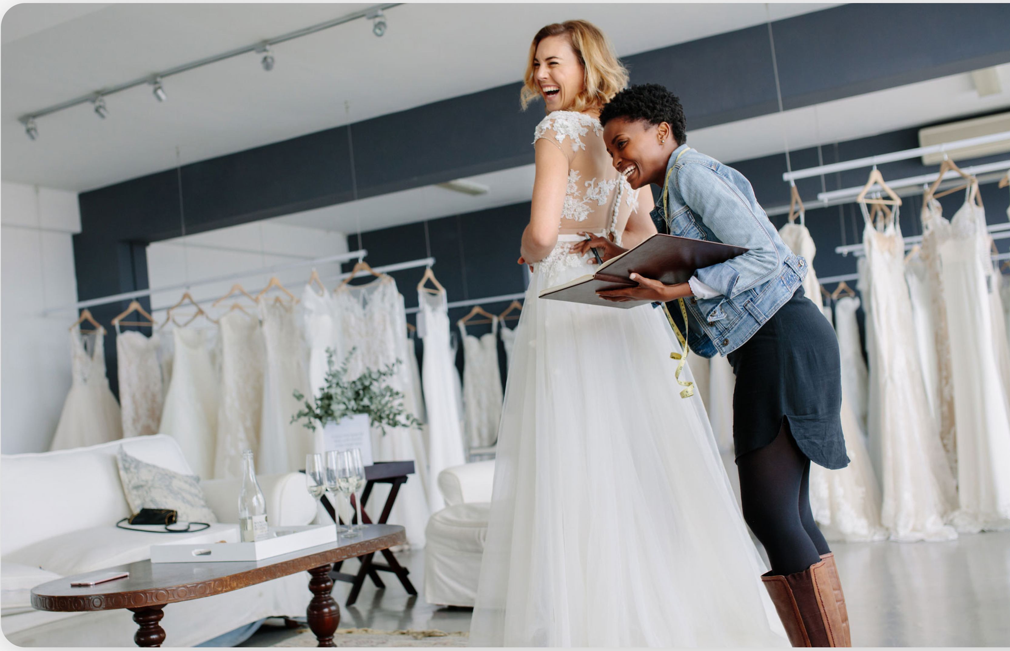 Couple in wedding dress shop